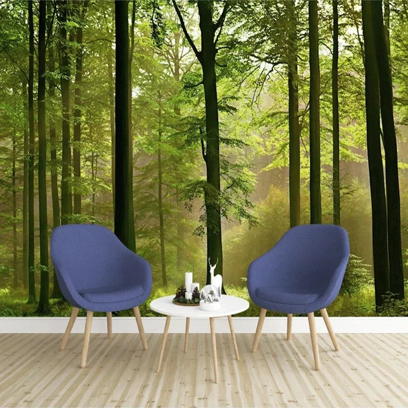 Twee blauwe leunstoelen met houten poten tegenover een kleine ronde tafel.